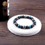 Obsidian and hematite bracelet with triple protection hawk's eye